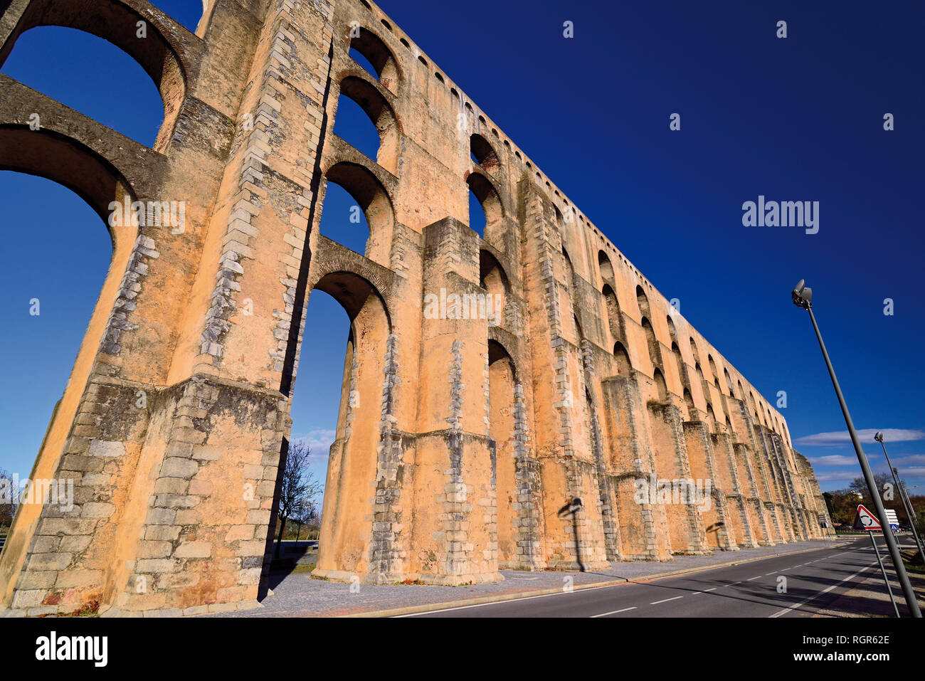 Detail of historic aqueduct contrasting clean blue sky Stock Photo