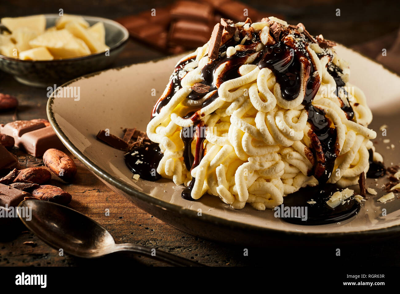 Spaghetti ice cream dessert with sweet chocolate topping Stock Photo
