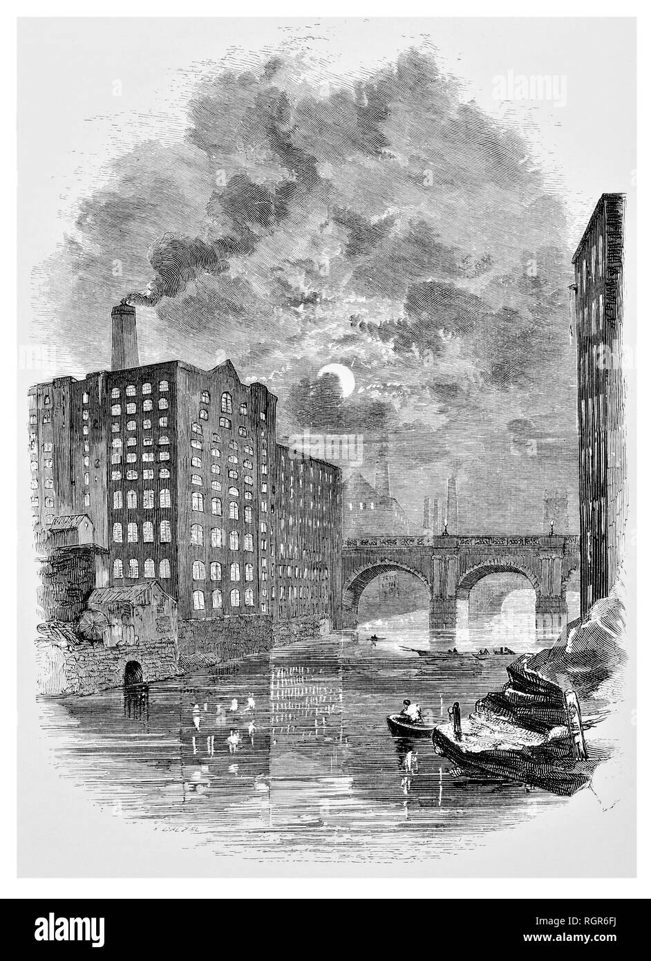 The River Irwell and factories by night Stock Photo