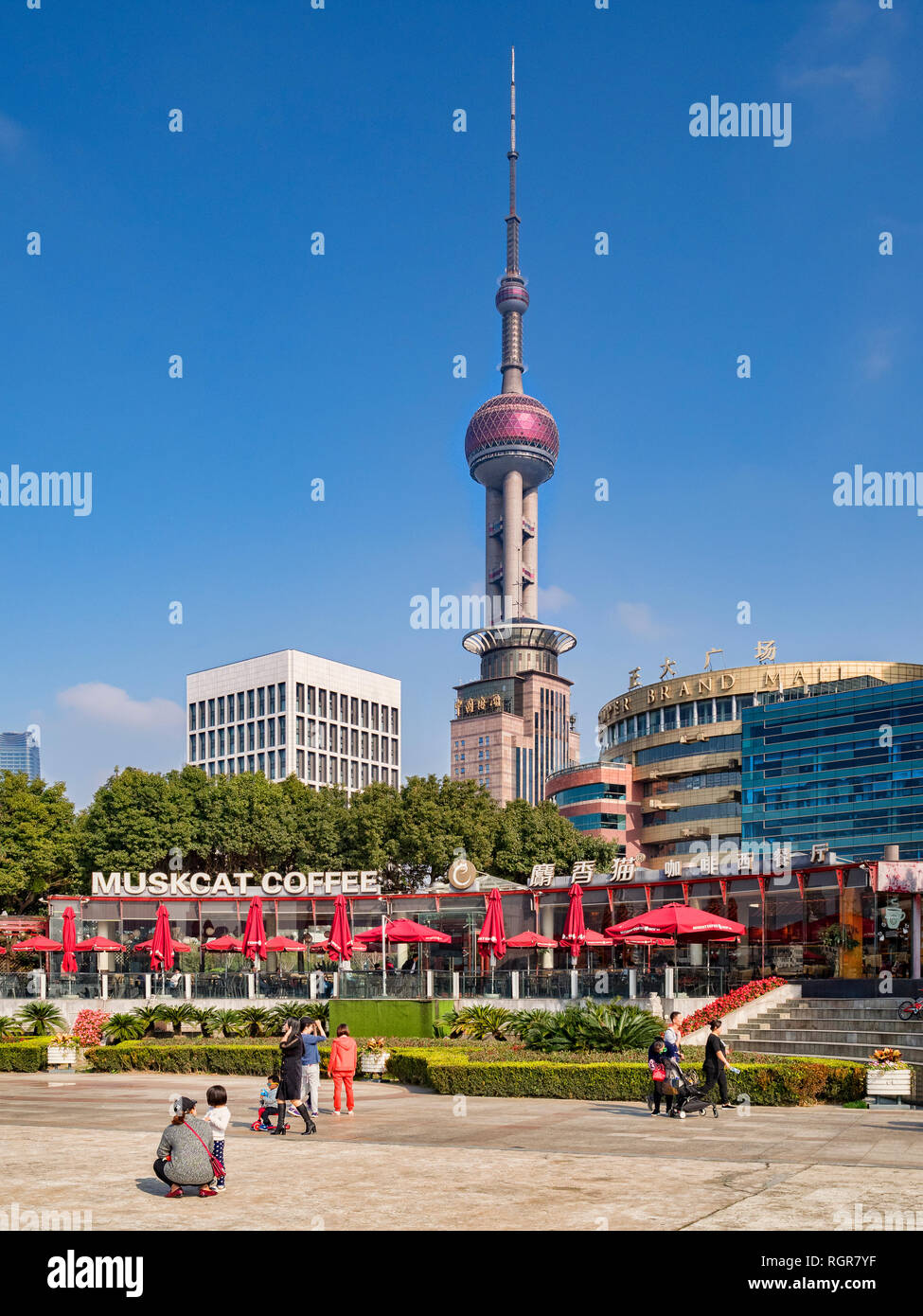 1 December 2018: Shanghai, China - Cafe on the East bank of the Huangpu River, Pudong, Shanghai, with a skyline dominated by the Oriental Pearl Tower. Stock Photo
