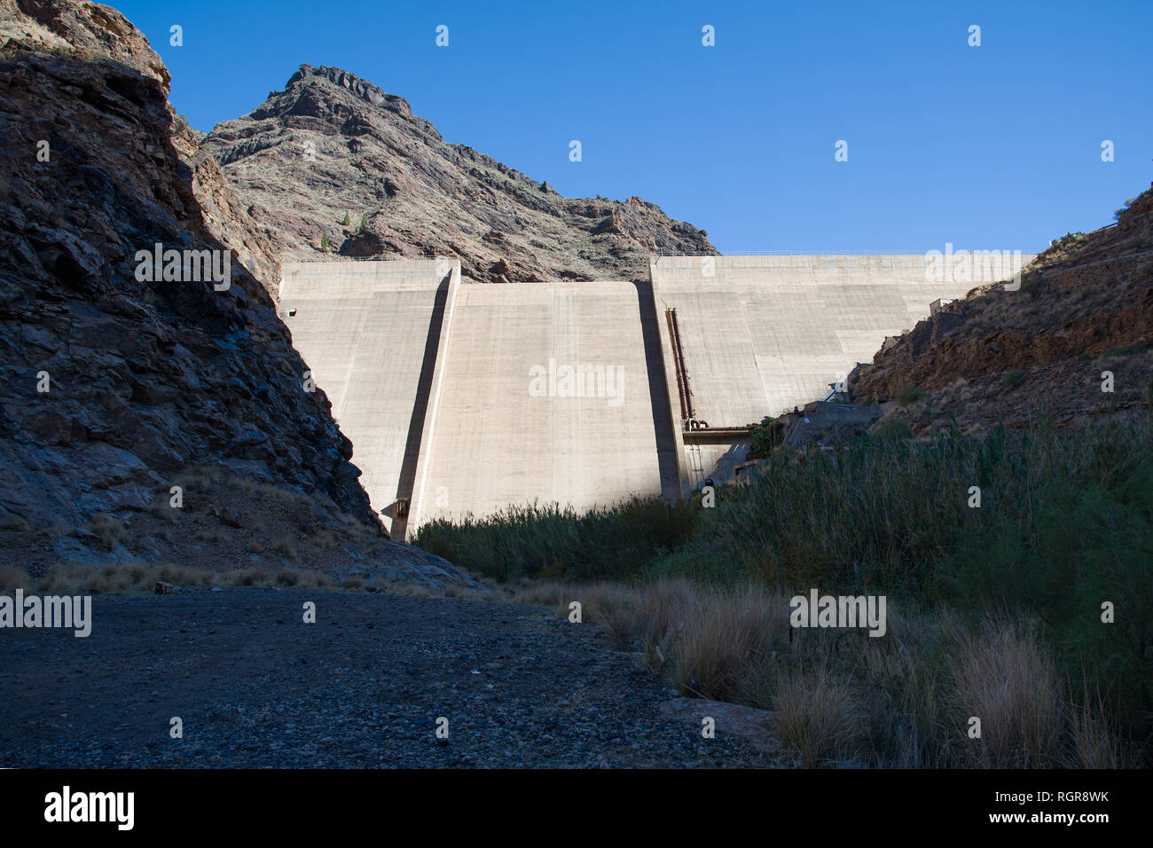 Reservoir Dam - Presa Del Parralillo in mountains, altitude 53 m in Gran Canaria, Spain, Stock Photo