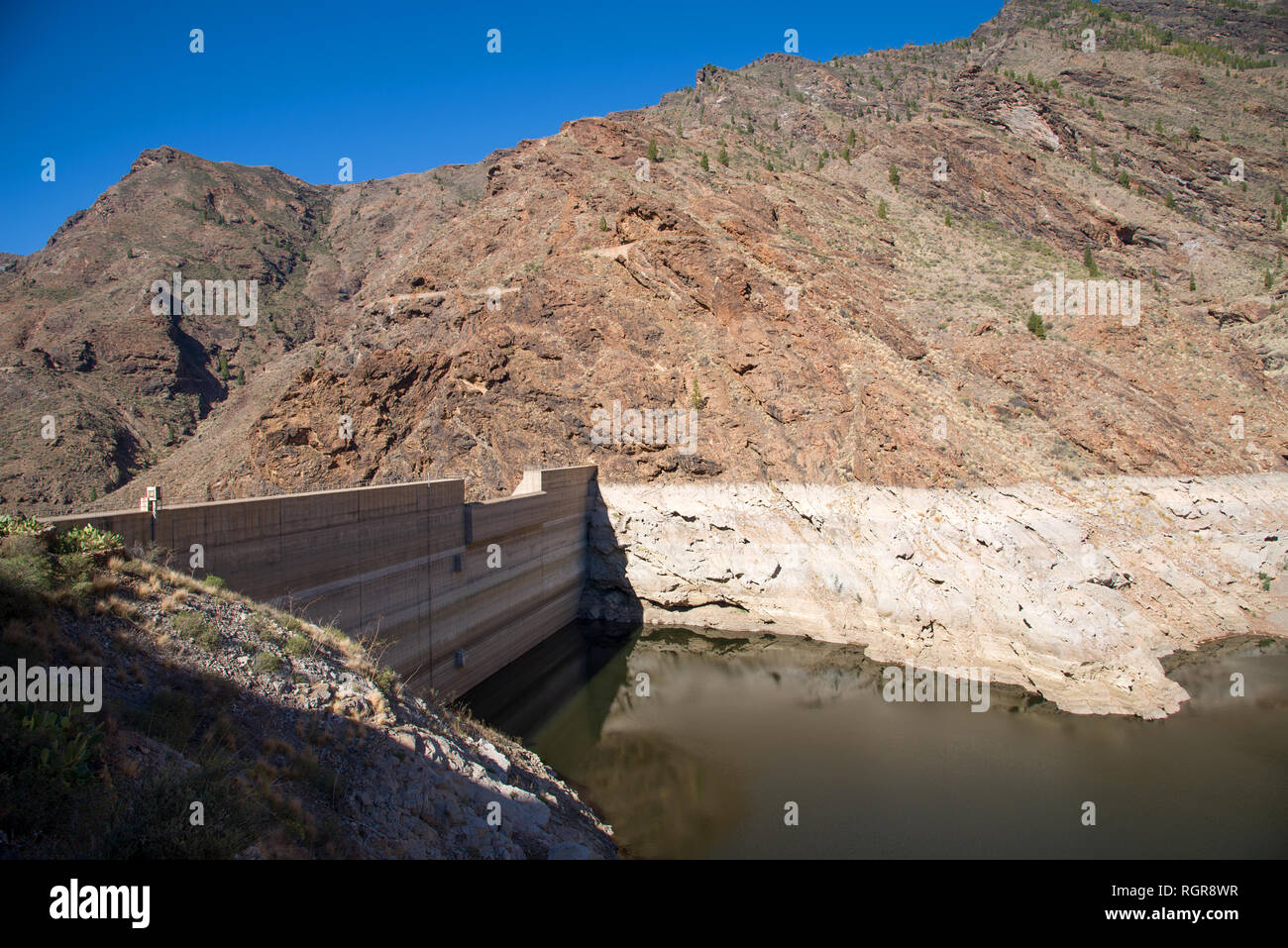 Reservoir Dam - Presa Del Parralillo in mountains, altitude 53 m in  Gran Canaria, Spain, Stock Photo