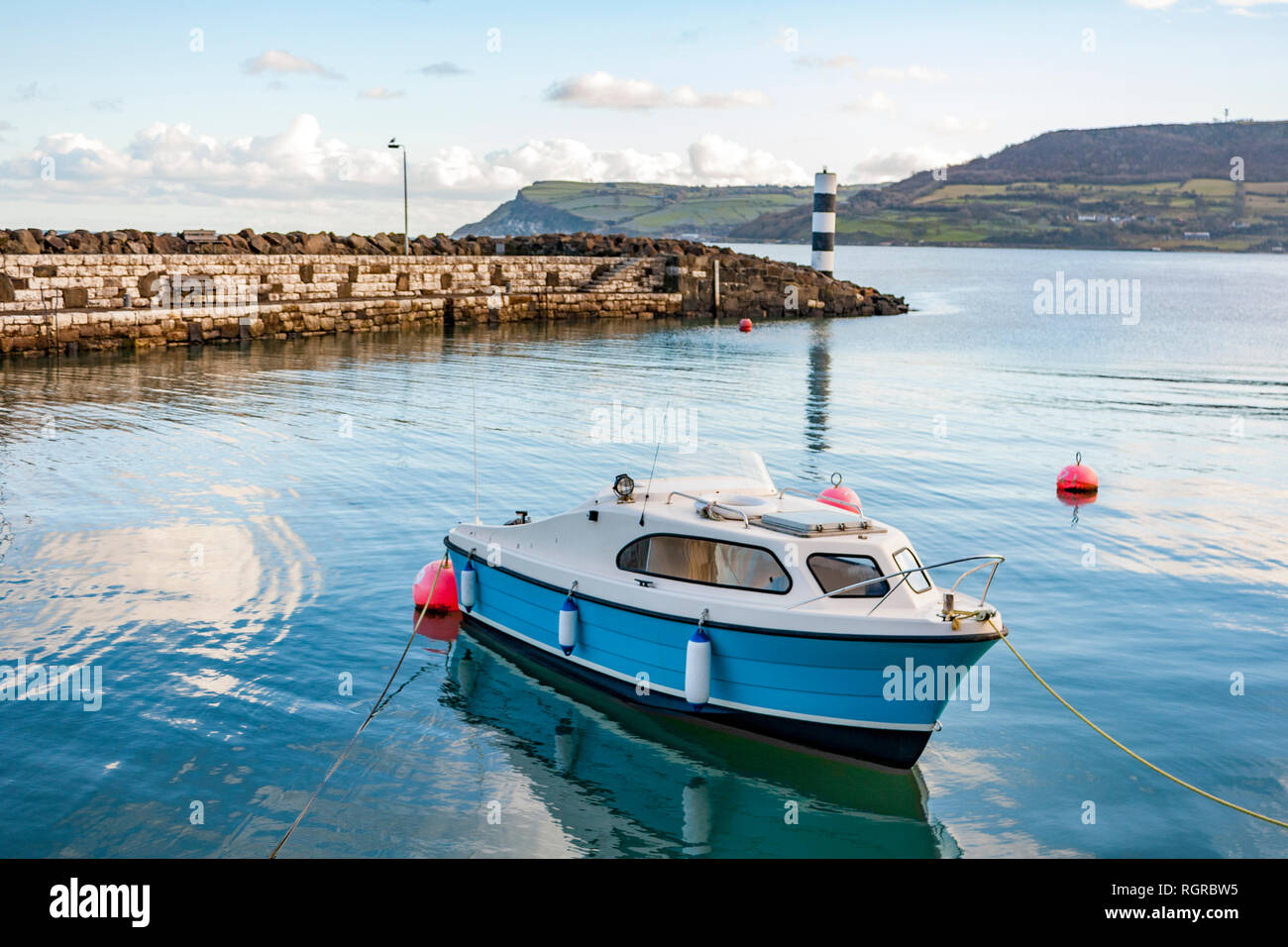 Picturesque harbour on the shores of Carnlough Bay. Typical village in Northern Ireland. Stock Photo