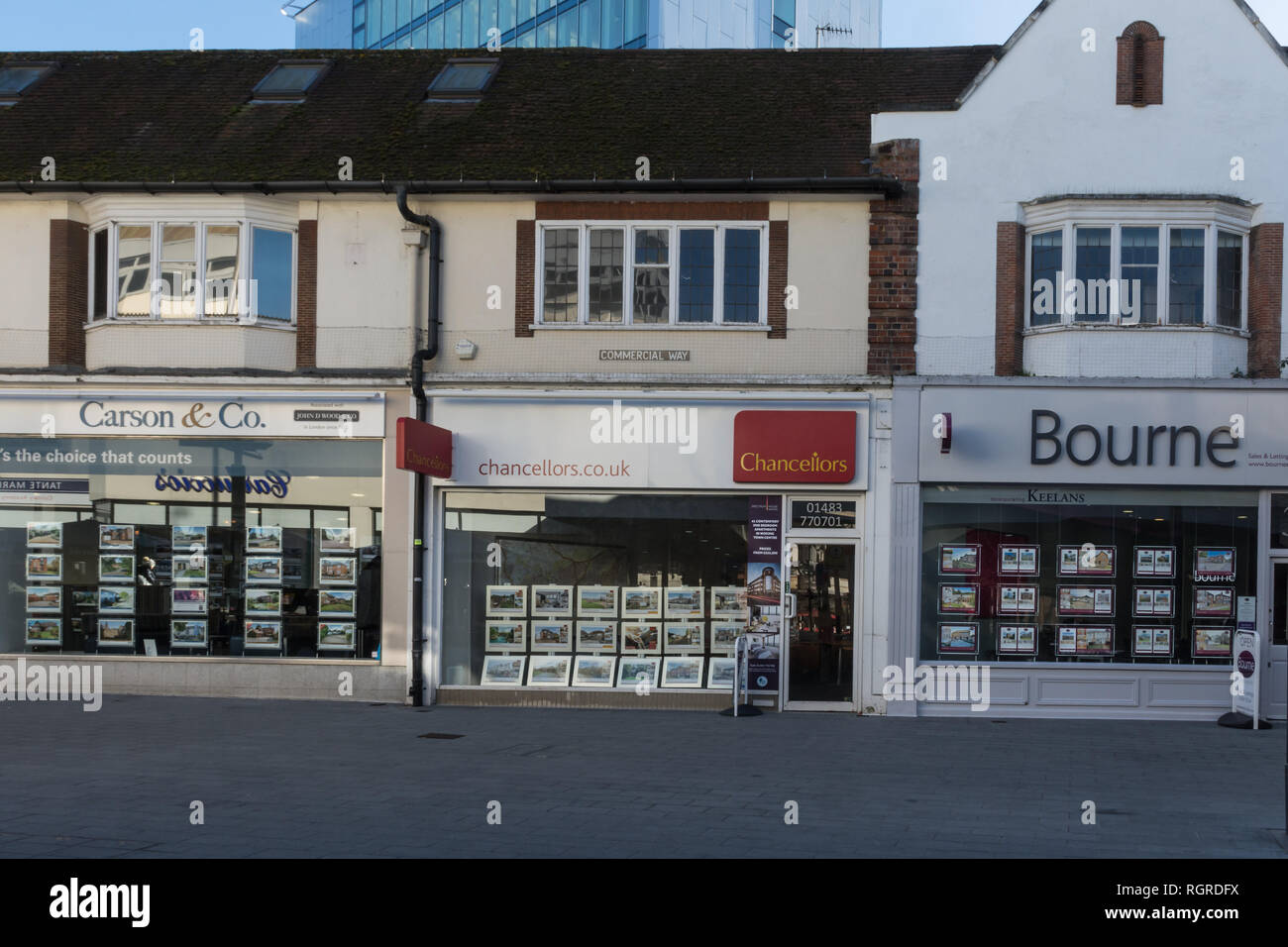 Row of three estate agents offices in Woking town centre, Surrey, UK