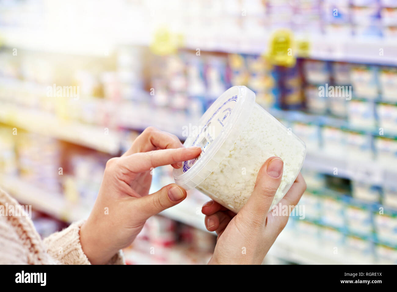 Buyer Hands With Plastic Container Of Cottage Cheese In The