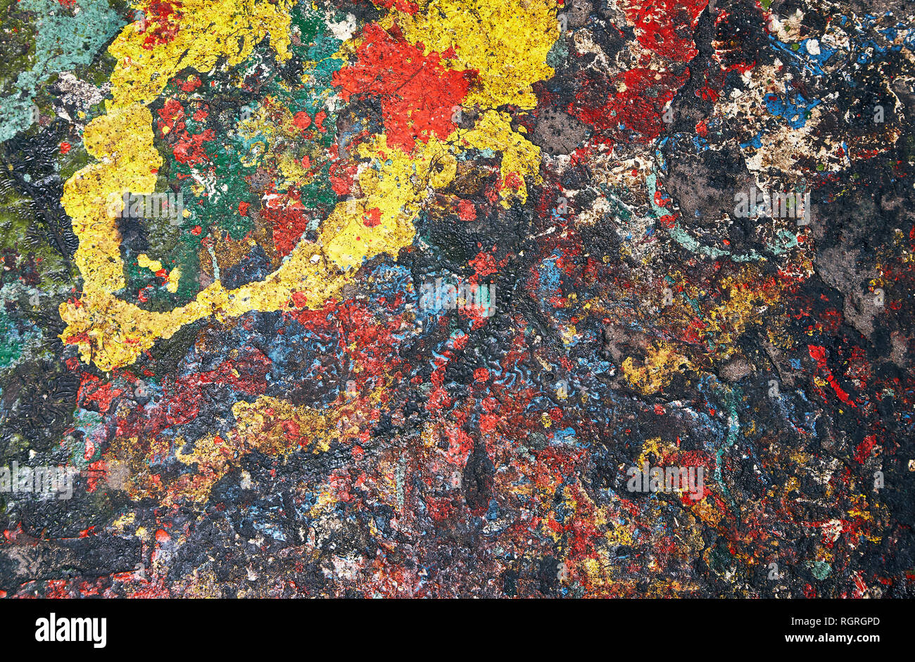 Abstract background formed by colored paint stains randomly spilled on the floor Stock Photo