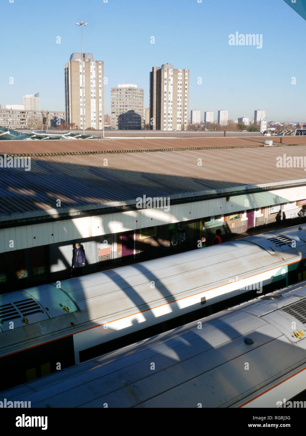 Looking over two platforms and across the skyline from Clapham Junction station in South London. Stock Photo