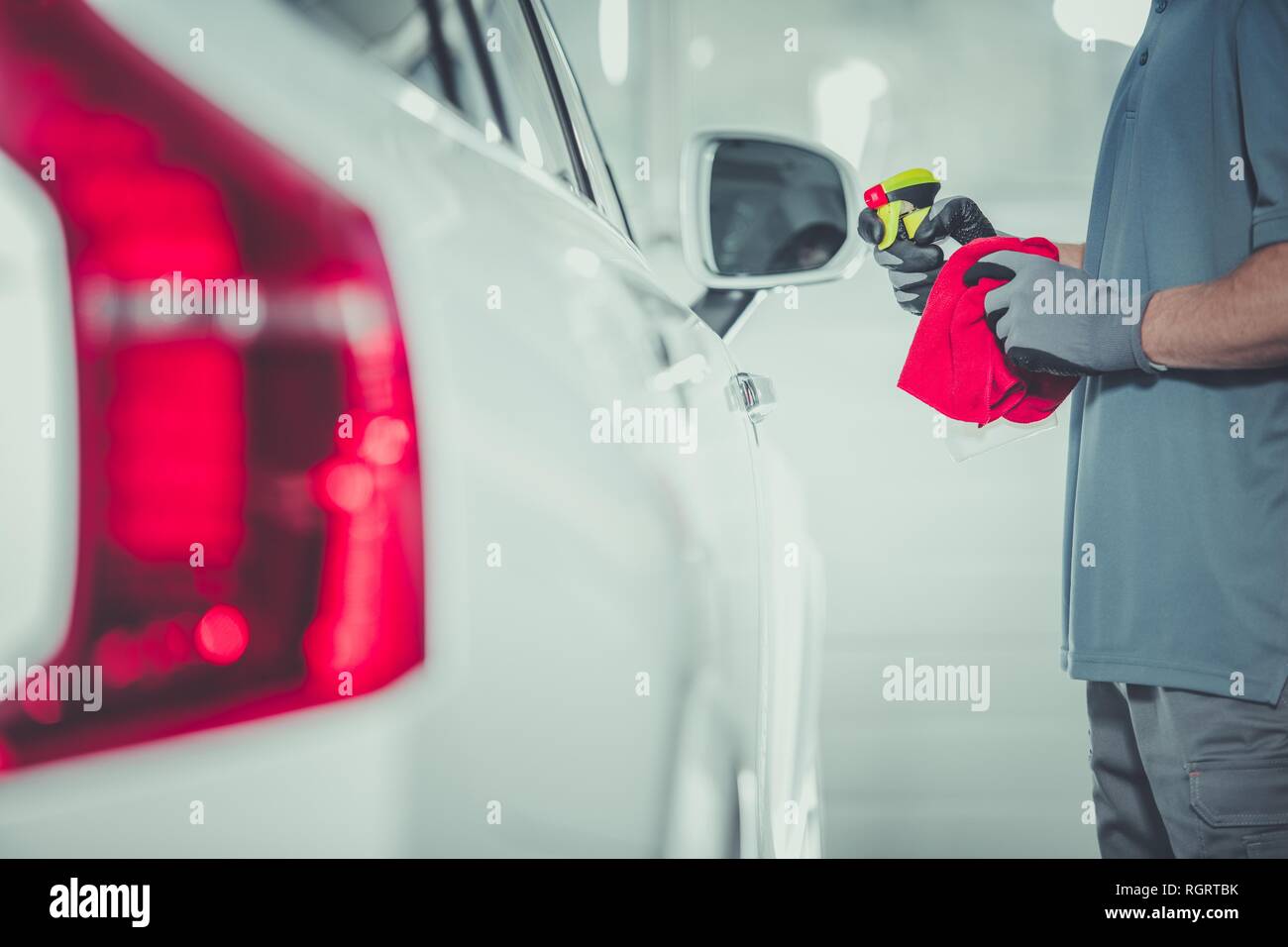 Automotive Industry. Car Body Paint Maintenance Using Special Paint Protectant. Stock Photo