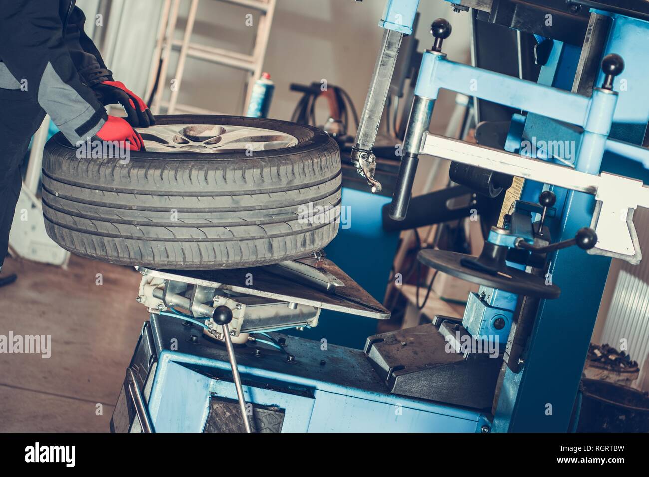 Car Wheels Maintenance. Seasonal Vehicle Tires Change. Automotive