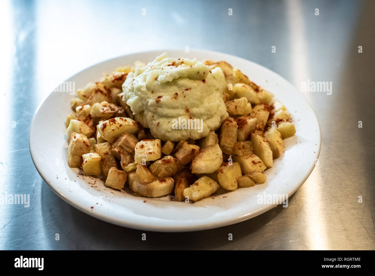 Yuca fried with hummus sauce. Stock Photo