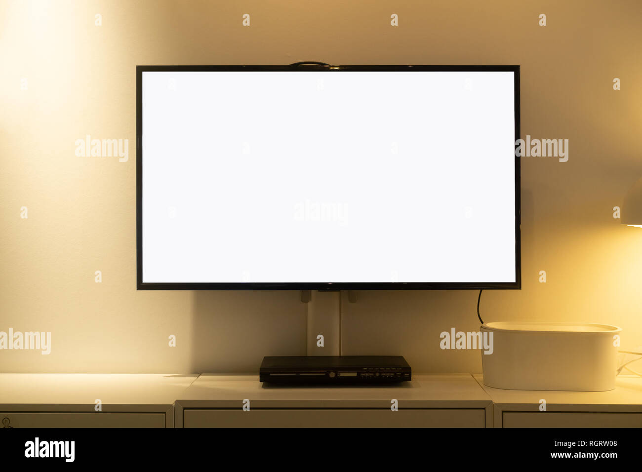 Living room led blank screen tv on concrete wall with wooden table and media player. Mockup blank screen TV for copy space. Stock Photo