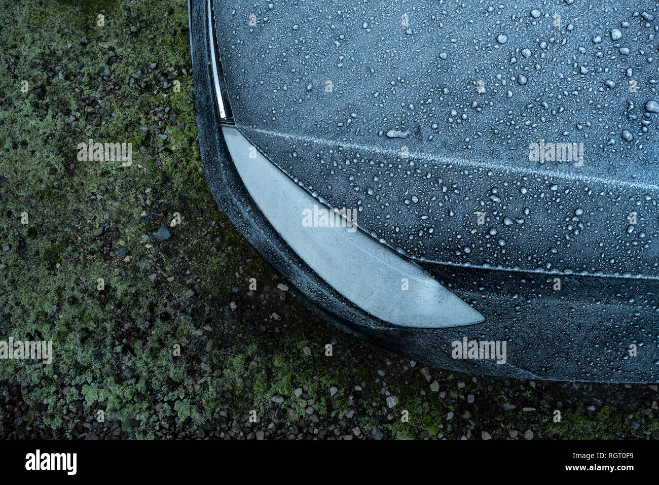 Frost covered car bonnet and headlight. Stock Photo