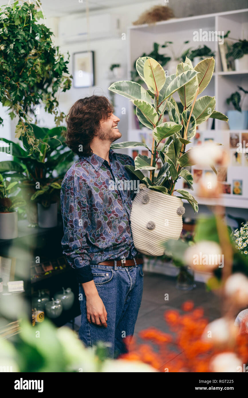 big plant in woolen pot. Flower shop 