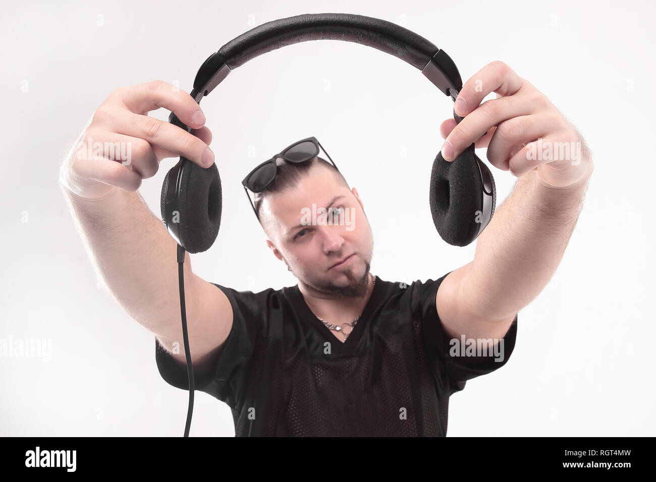 close up. stylish rapper shows headphones .isolated on white Stock ...