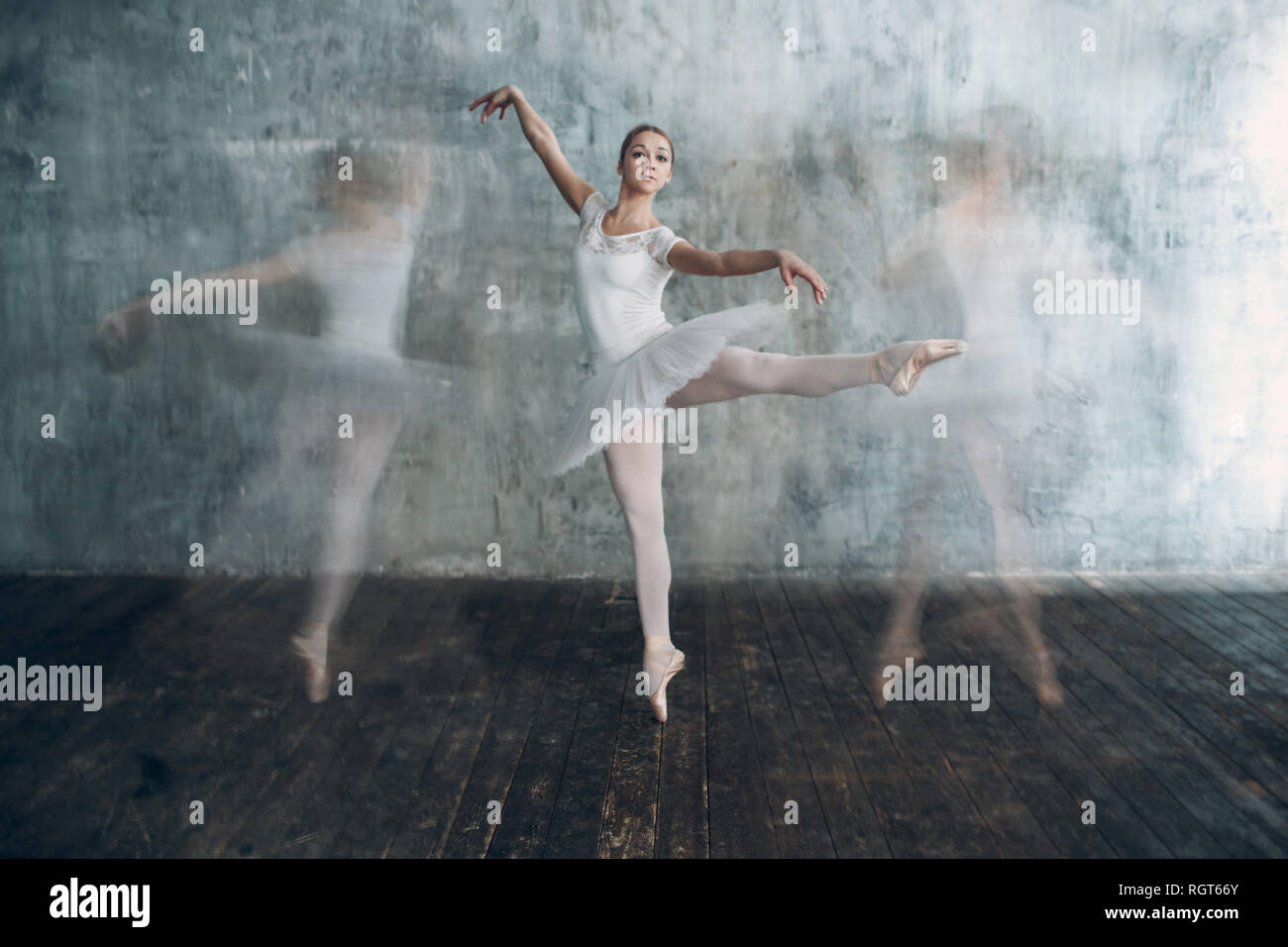 Ballerina female. Young beautiful woman ballet dancer, dressed in professional outfit, pointe shoes and white tutu. Multiple exposure. Stock Photo