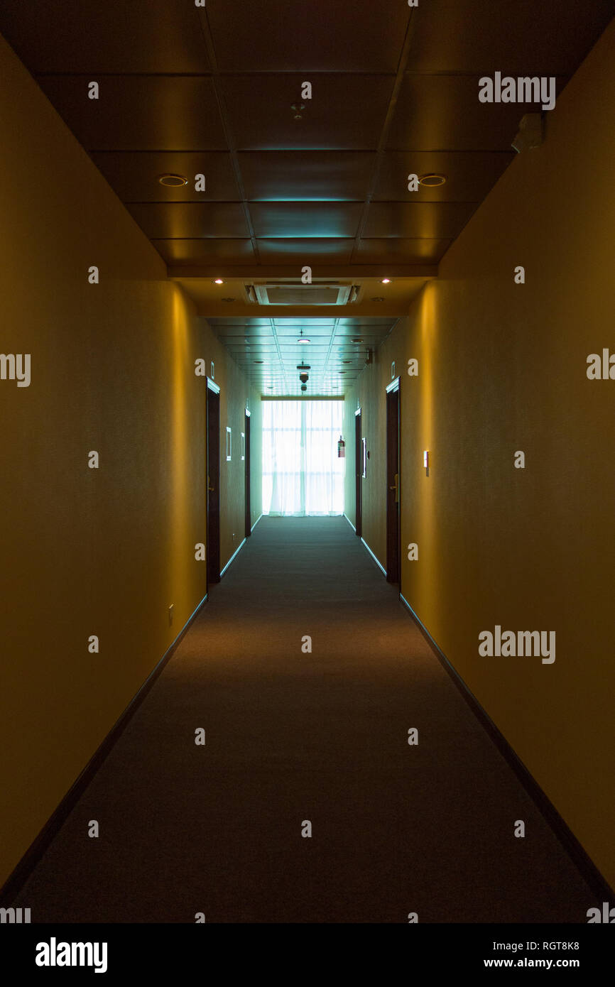 Empty hotel interior, light at the end corridor. The end concept Stock Photo