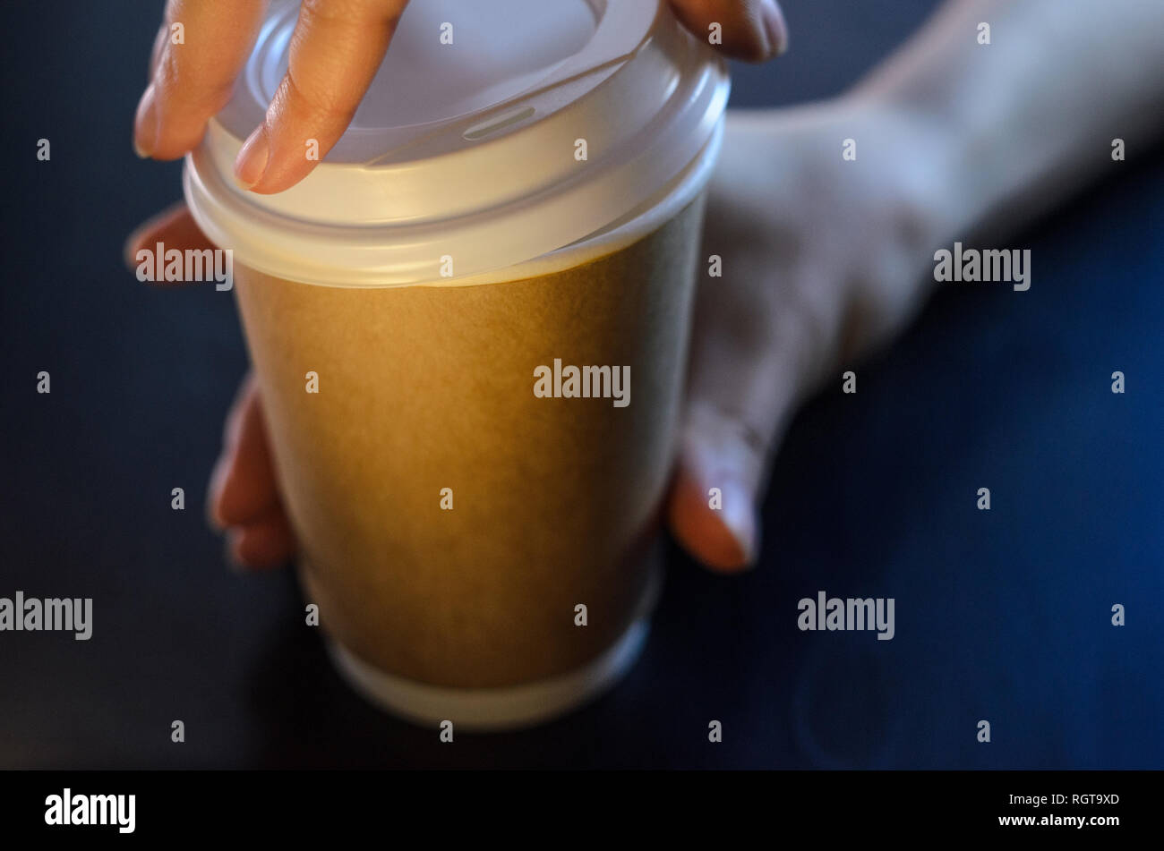 Barista serves a cup of coffee. Paper cup Plastic cap Coffee Barista ...