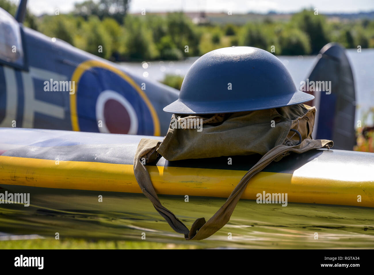 Tin hat on spitfire wing Military Show Armed Forces Day Derbyshire England Stock Photo