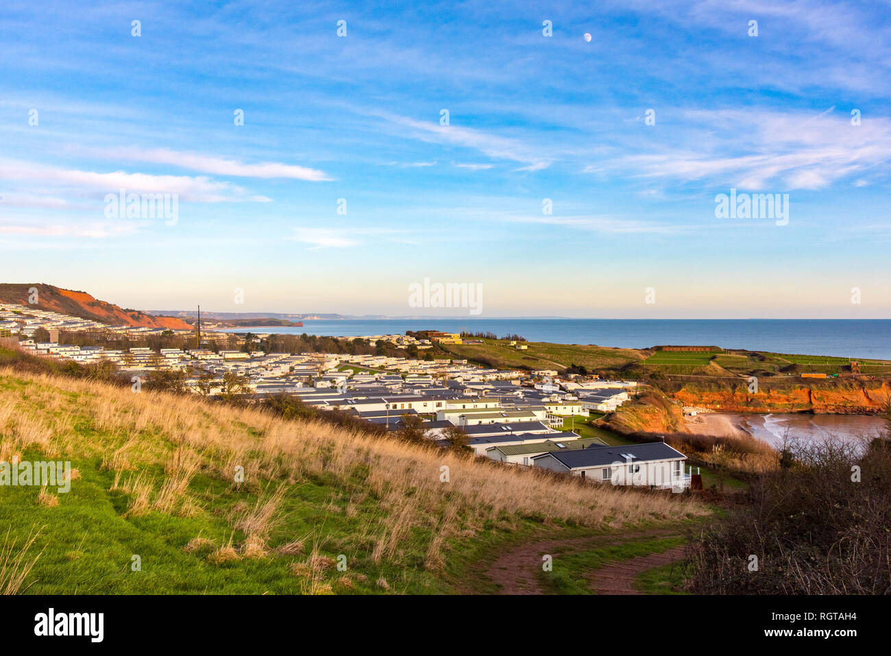 View of the Devon Cliffs Holiday Park at Sandy Bay, Exmouth, Devon, UK. With Budleigh Bay and Otter Head in the distance. Stock Photo