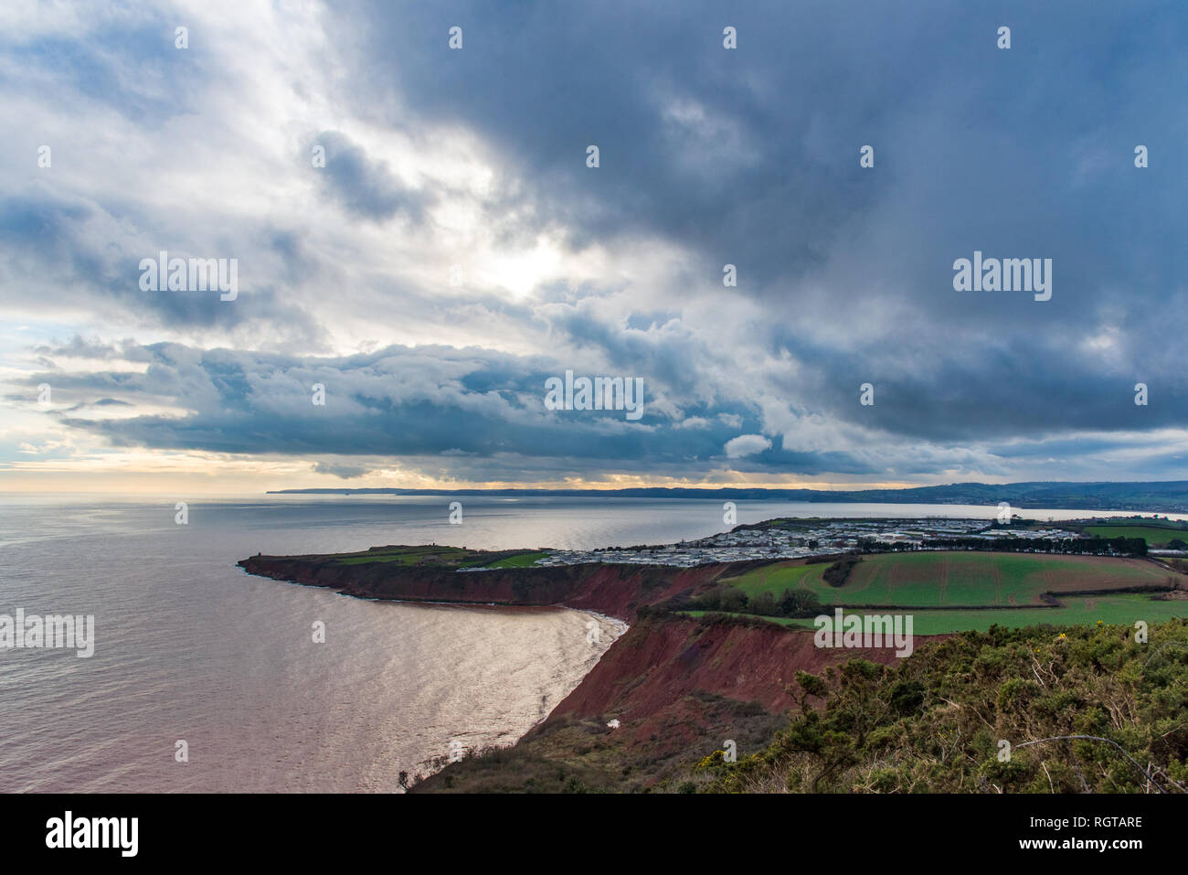 EXMOUTH, DEVON, UK - 17Jan2019: View of the triassic red sandstone Straight Point and part of the Devon Cliffs Holiday Park. From West Down Beacon. Stock Photo