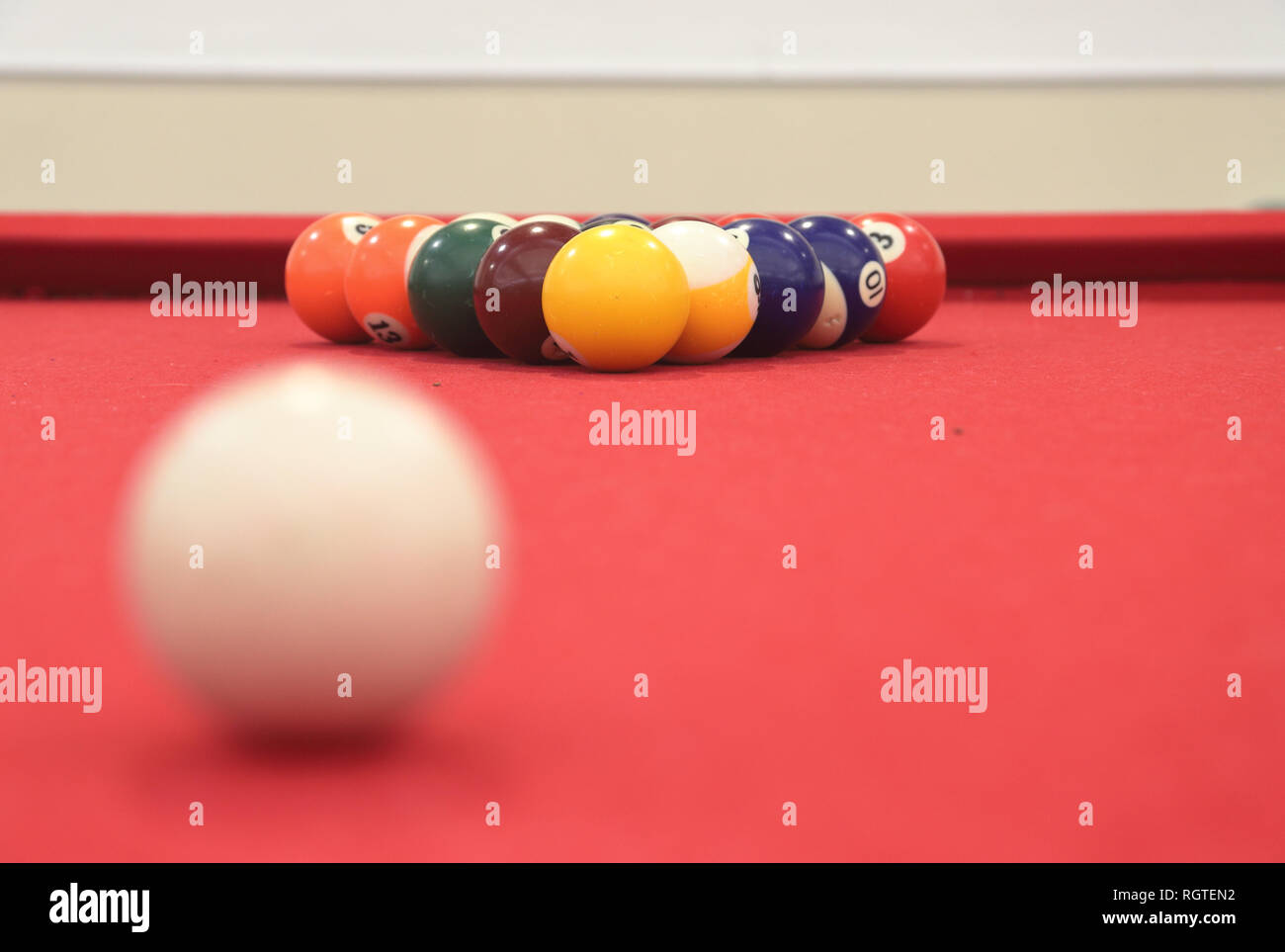 Billiards table with balls in focus looking past cue ball Stock Photo