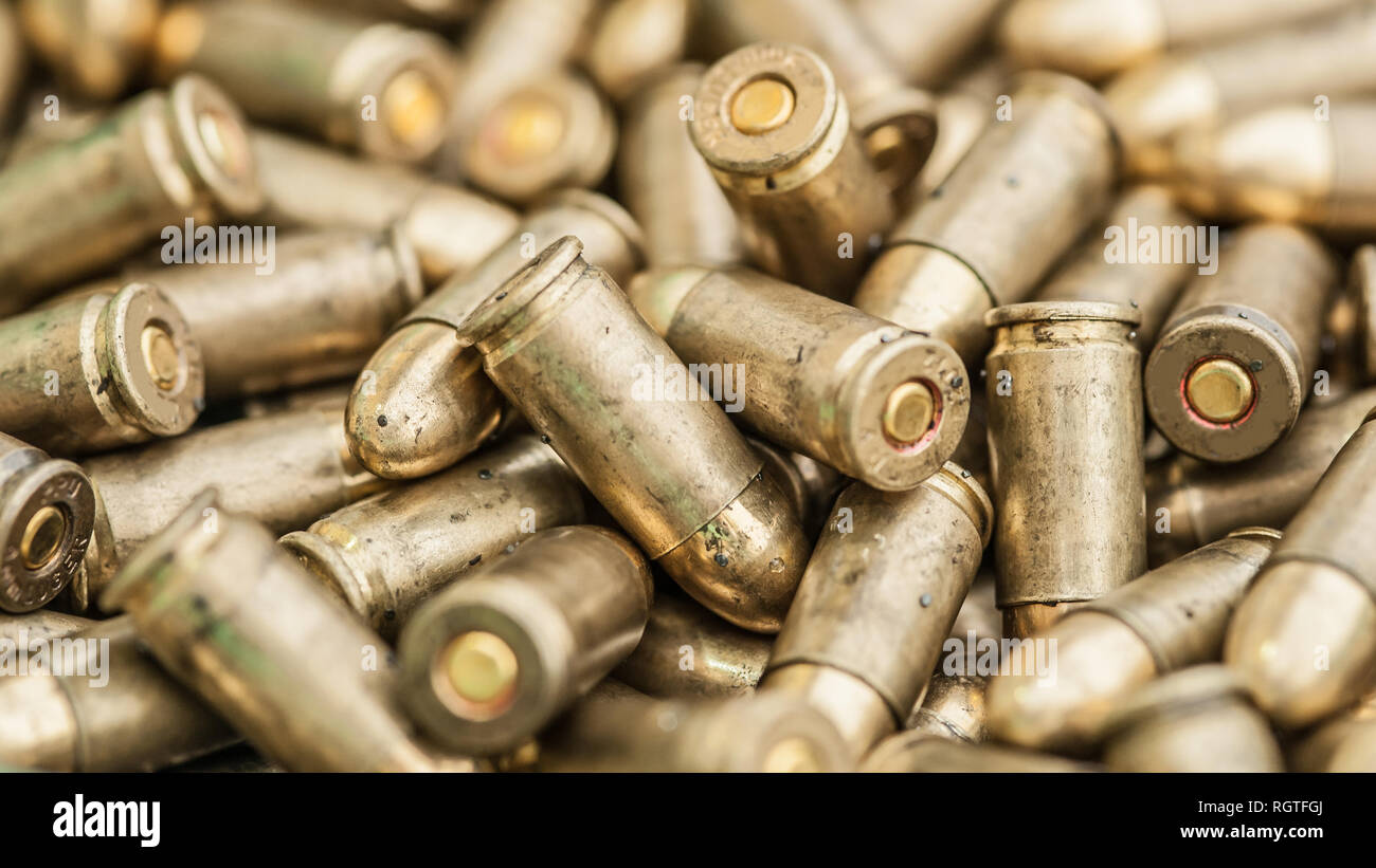 Top detail macro view of large group of gun bullets. Ammunition background pattern Stock Photo