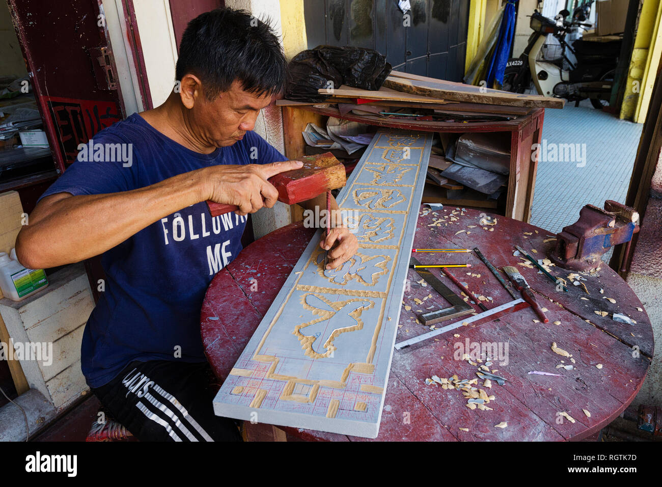 wood carving of a Chinese calligraphy sign in George Town, Penang, Malaysia Stock Photo