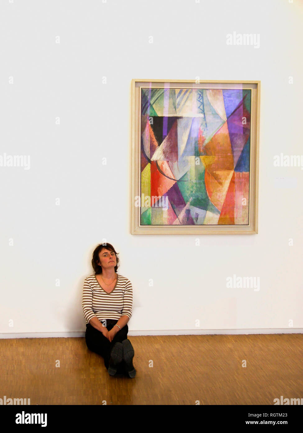 Musée d'Art Moderne, Pompidou Centre, Paris, France: lady and painting.  MODEL RELEASED Stock Photo