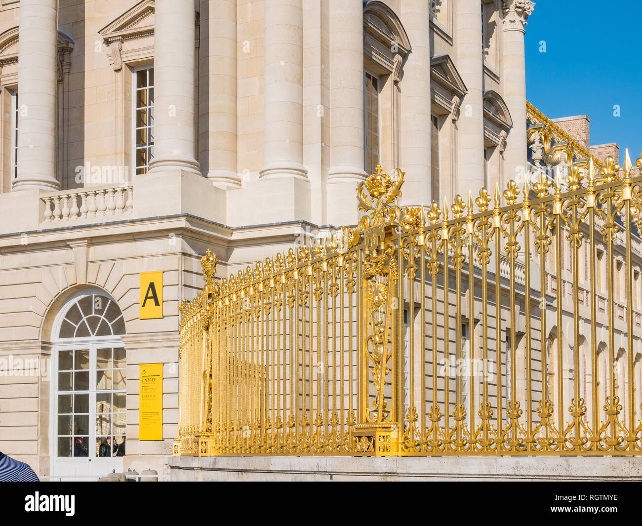 The golden entrance gate of the famous Palace of Versailles at France