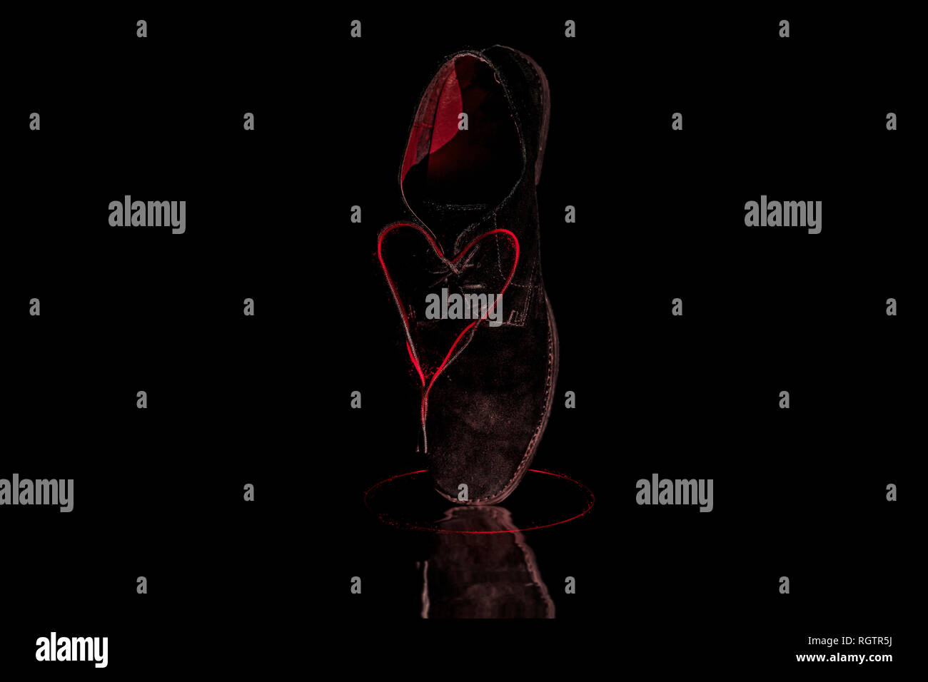 Shoe with red heart strings Stock Photo Alamy