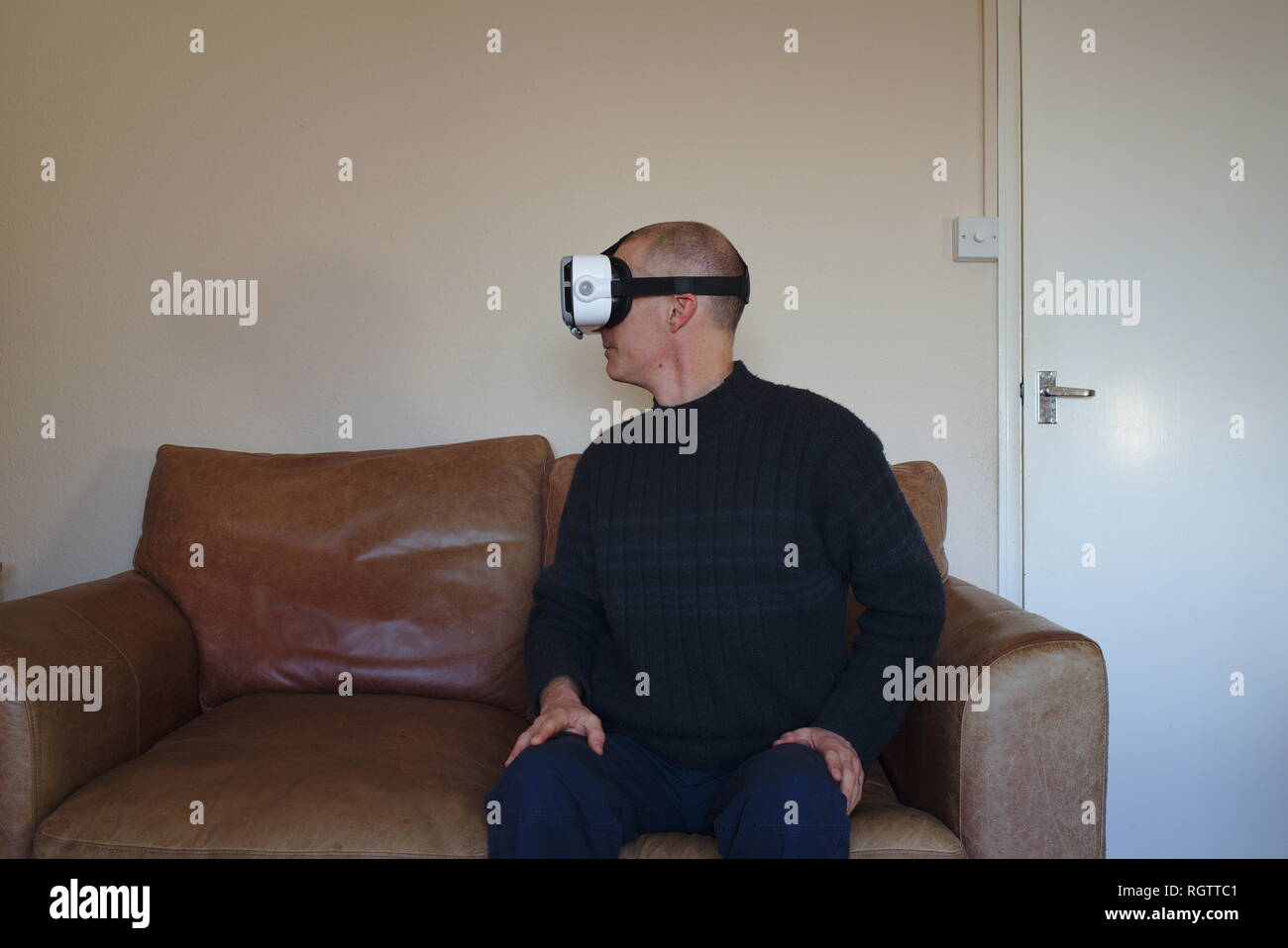 Man wearing virtual reality headset Stock Photo