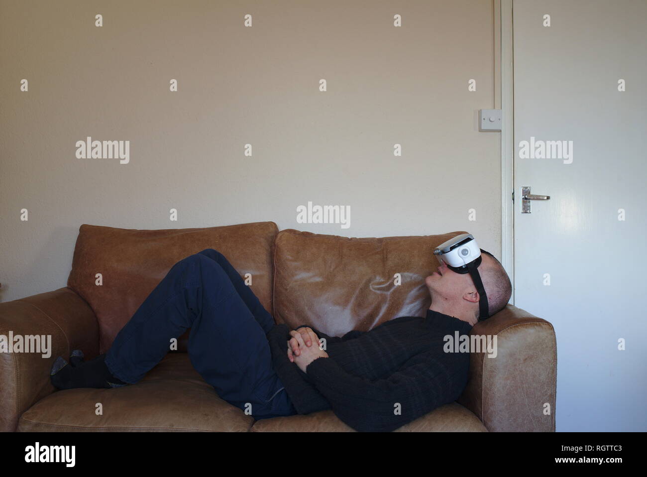 Man wearing virtual reality headset Stock Photo