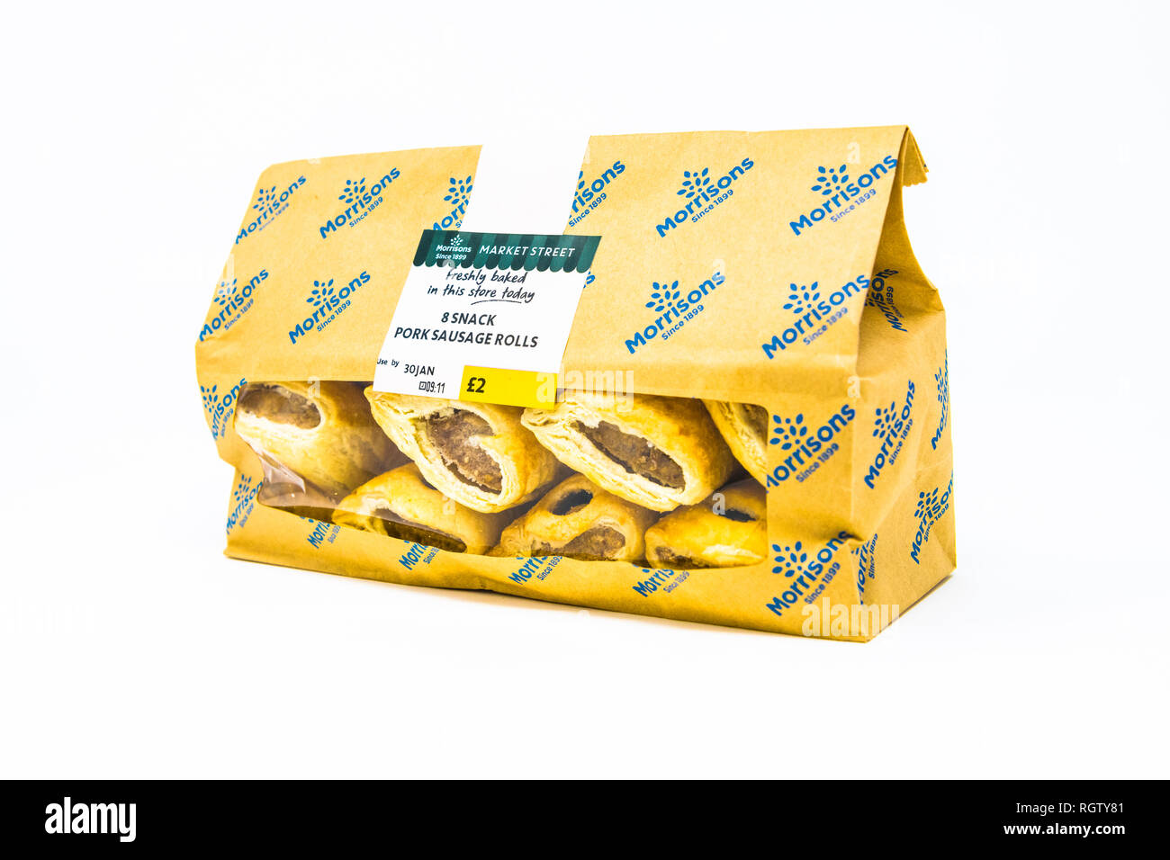 A pack of eight pork sausage rolls in a Morrisons paper bag with clear plastic window. Stock Photo