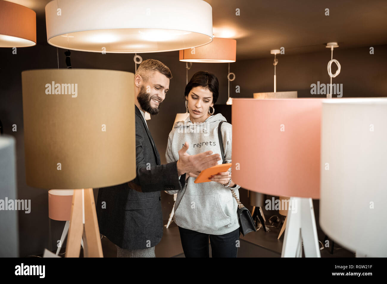 Curious couple having interesting conversation about appearance of their home Stock Photo