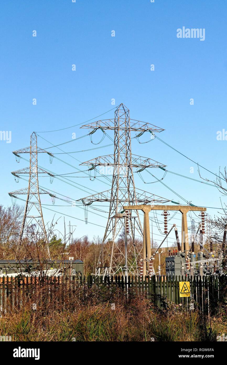 Electricity pylons and substation in New Haw Surrey England UK Stock Photo