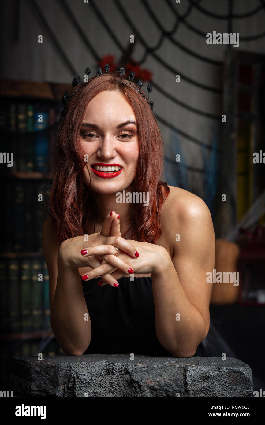 Beautiful woman in black dress hi-res stock photography and images - Alamy