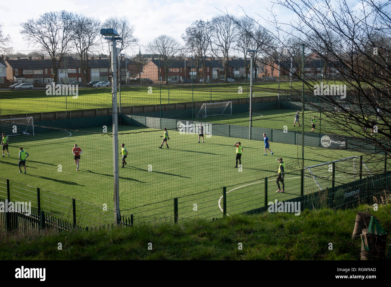 People playing football at Playfootball pitches at Bury College Stock Photo