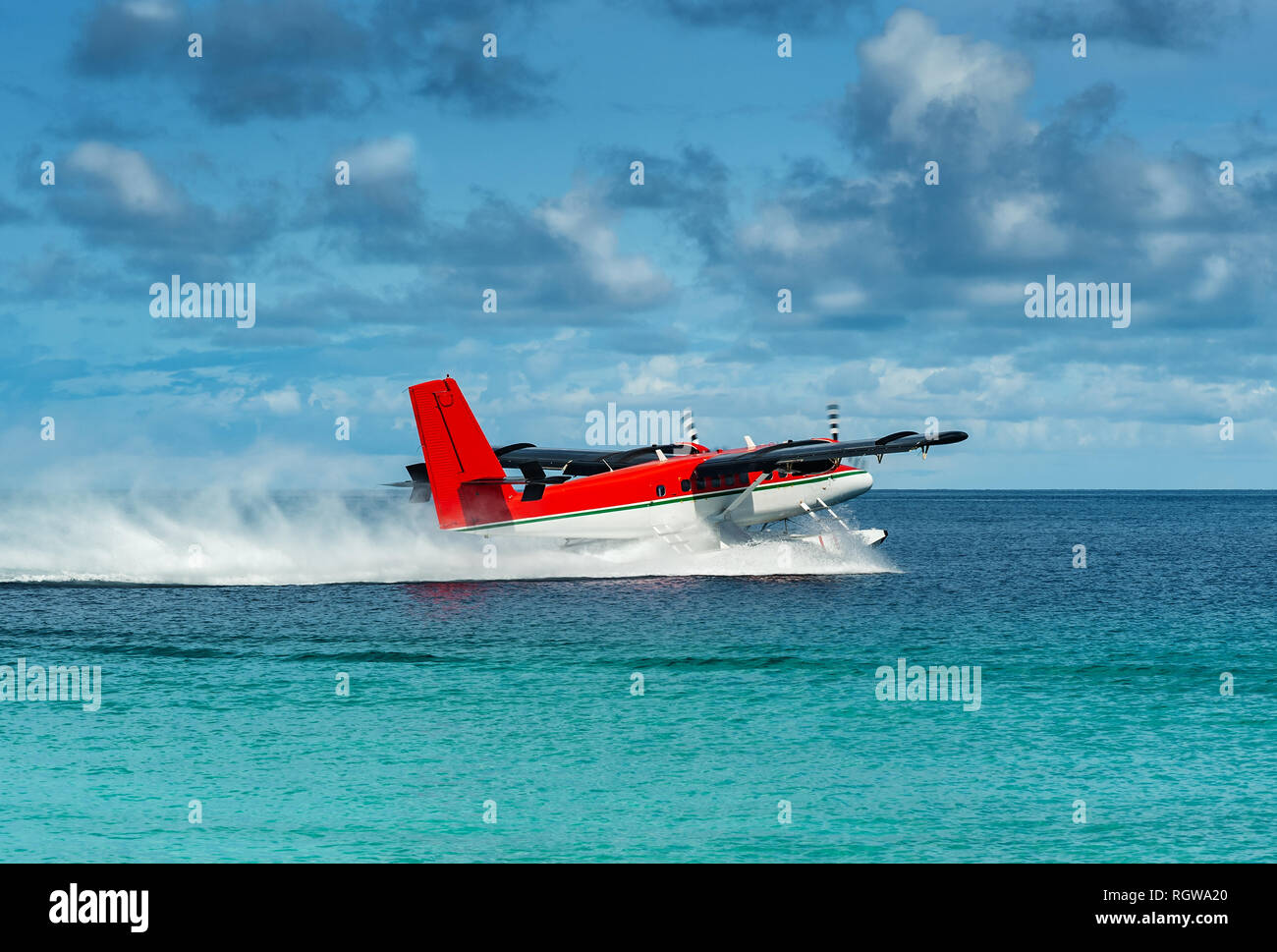 floatplane starting in the colorful waters of the indian ocean Stock