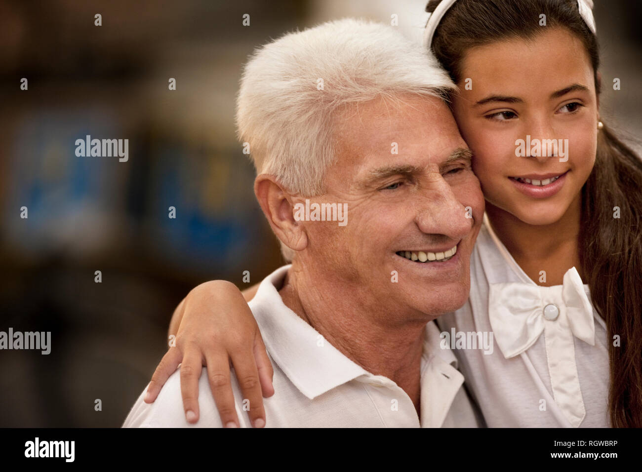 Young girl hugging her father. Stock Photo