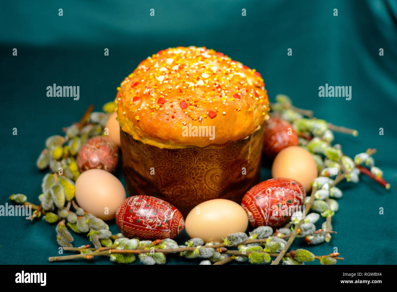 Easter eggs and bread on a dark background with willow branches background. 2019 Stock Photo