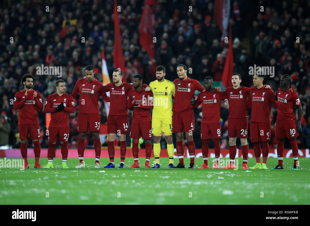 Liverpool players observe a minutes silence for Emiliano Sala during the  Premier League match at Anfield, Liverpool Stock Photo - Alamy