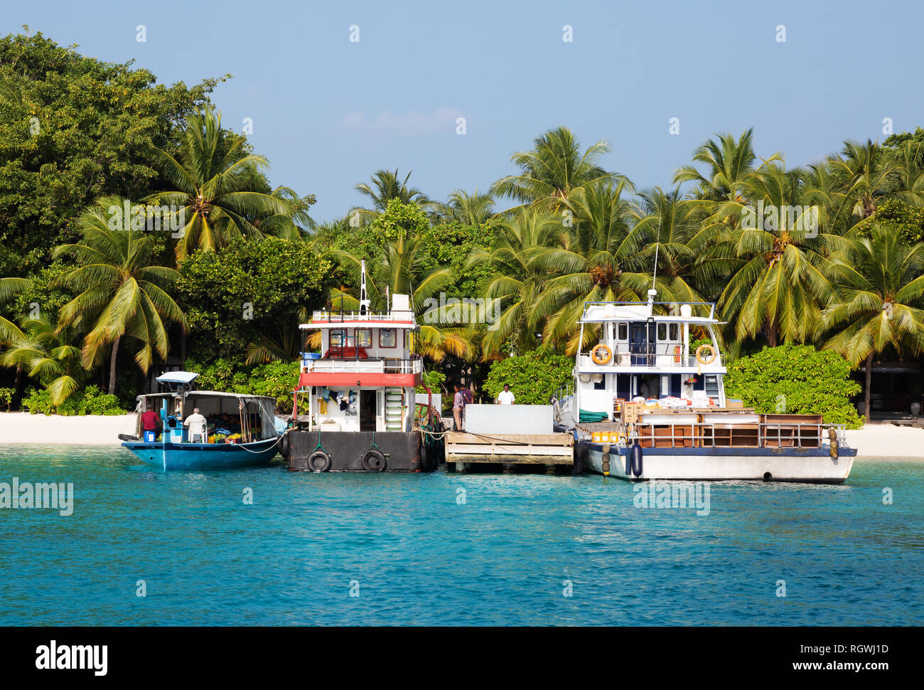 Maldives boat - working boasts in the small island harbour, Kuramathi island, Rasdhoo atoll, the Maldives Asia Stock Photo