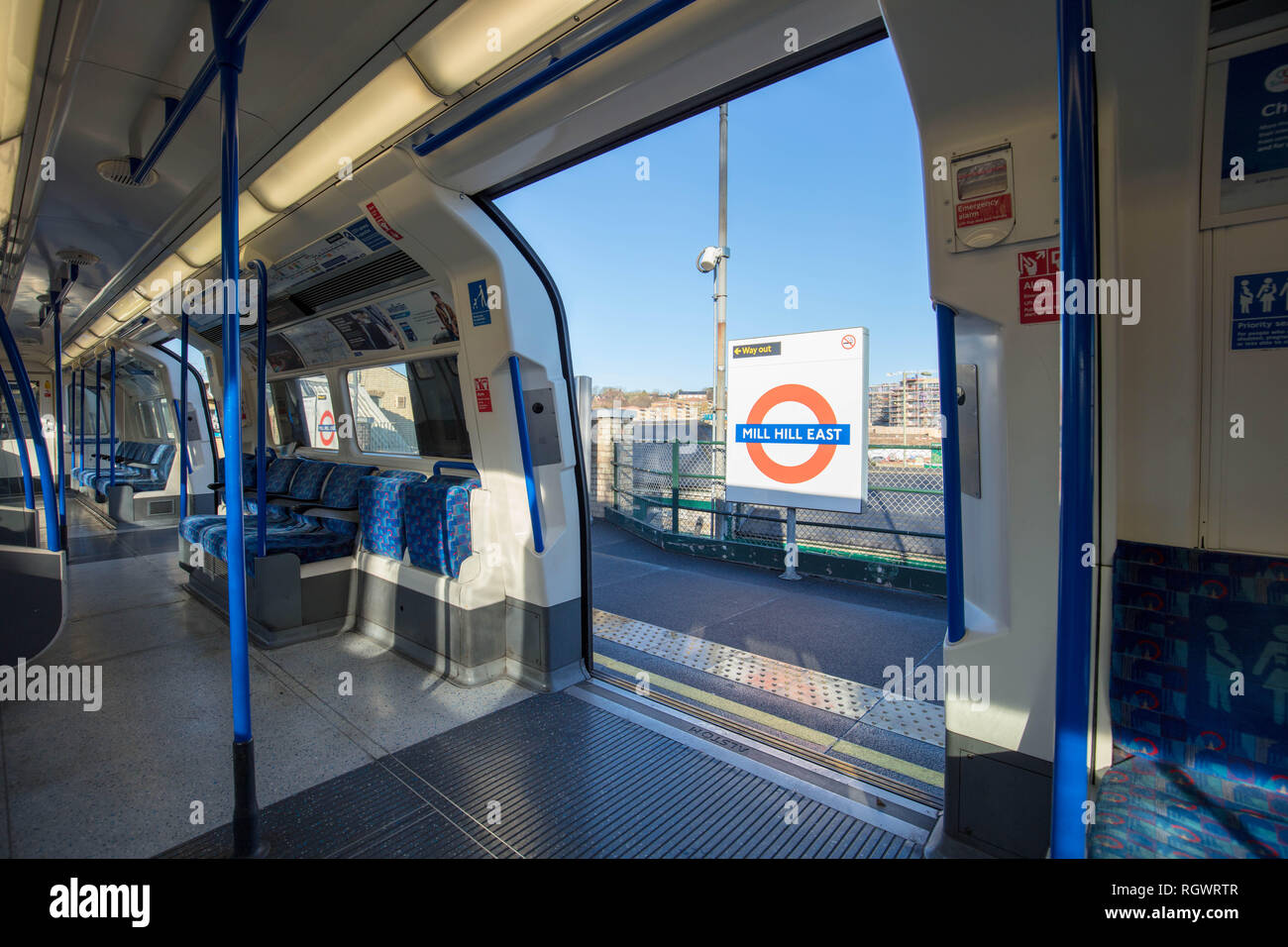 Mill Hill East Tube Station sign seen through the door of the interior