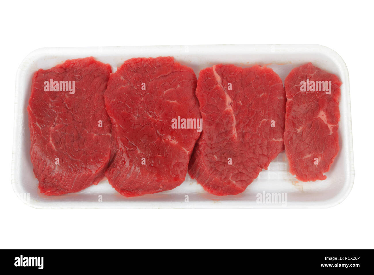 the pieces of raw fillet steaks in box isolated on white background Stock Photo