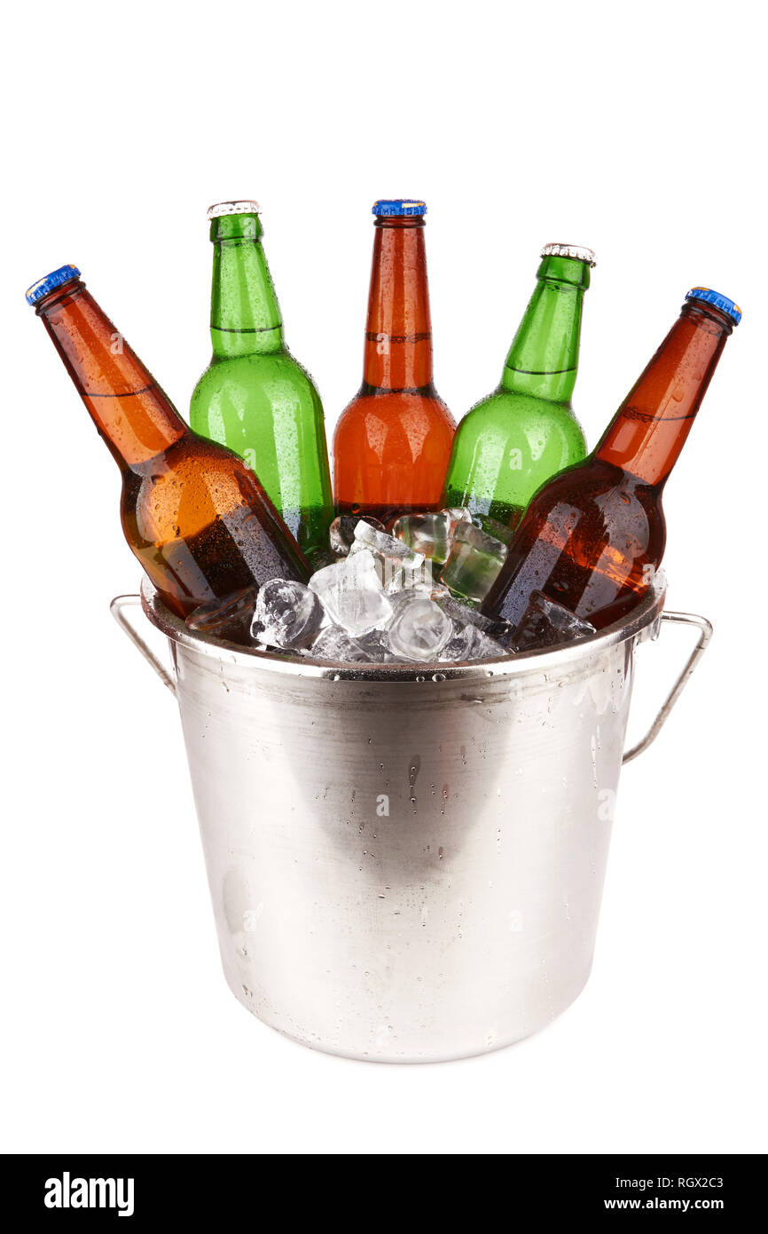 beer bottles in a bucket of ice isolated on a white background. Stock Photo