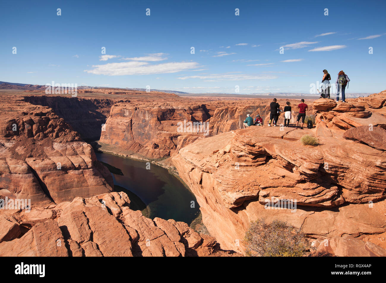 people along the cliffs of Horseshoe Bend in Arizona Page Stock Photo