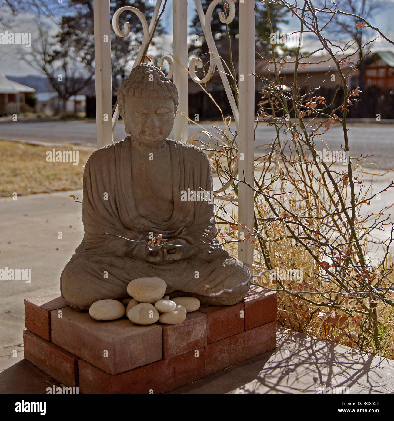 Statue of Buddha on the porch of a house Stock Photo - Alamy