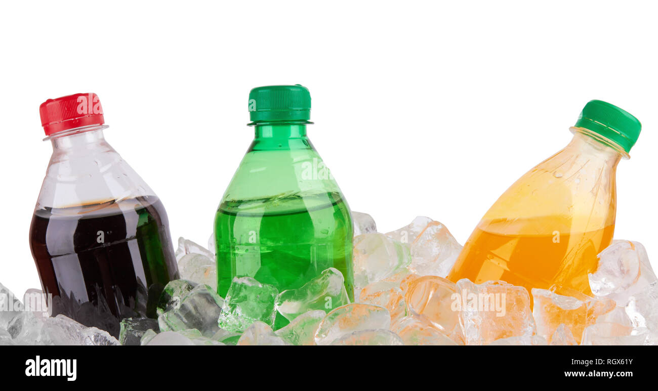 cold beverages in plastic bottles on heap of ice cubes Stock Photo