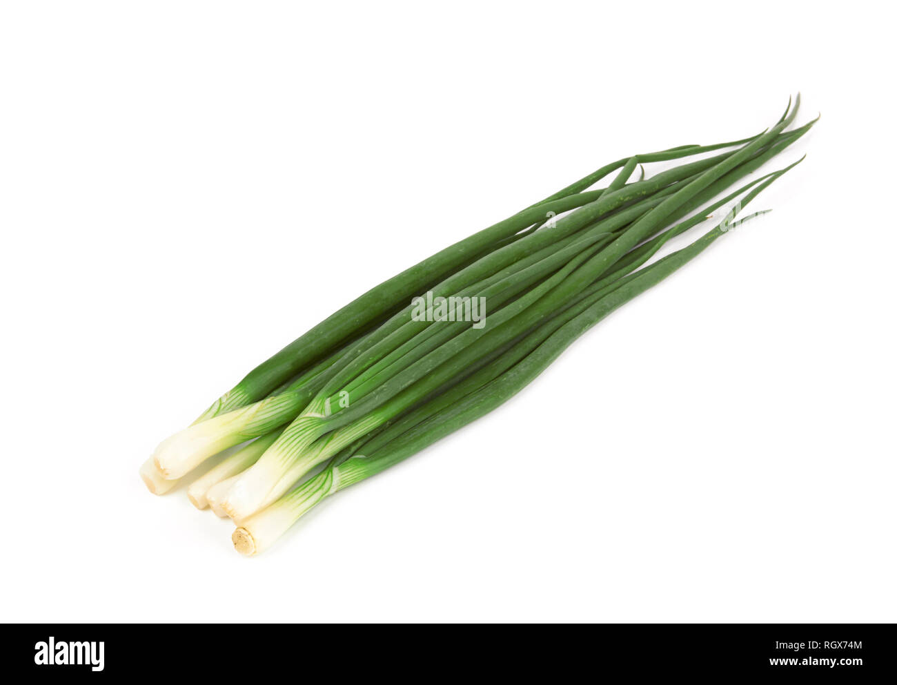 Green onions isolated on a white background Stock Photo - Alamy