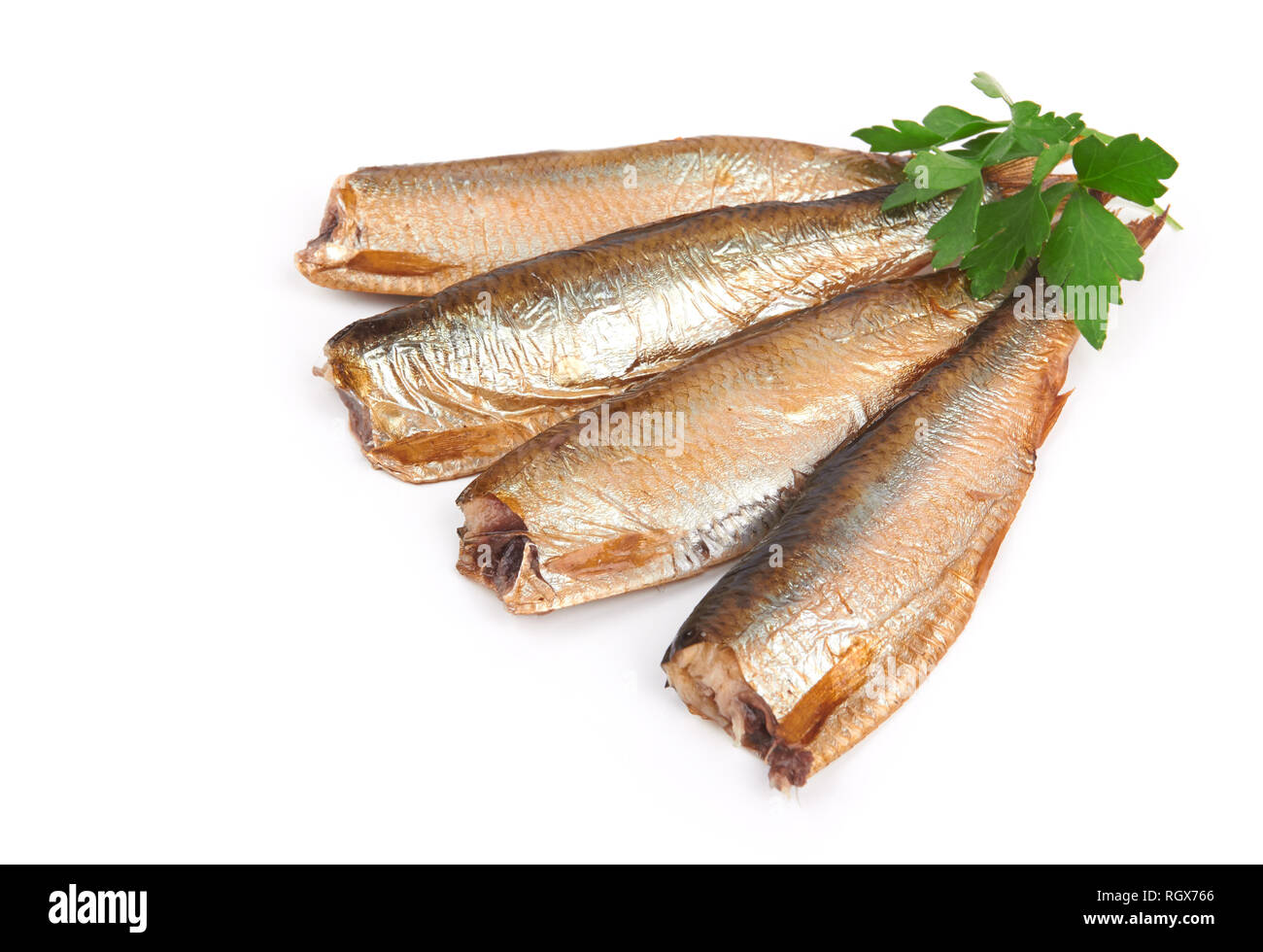 smoked sprats without heads isolated on white background Stock Photo